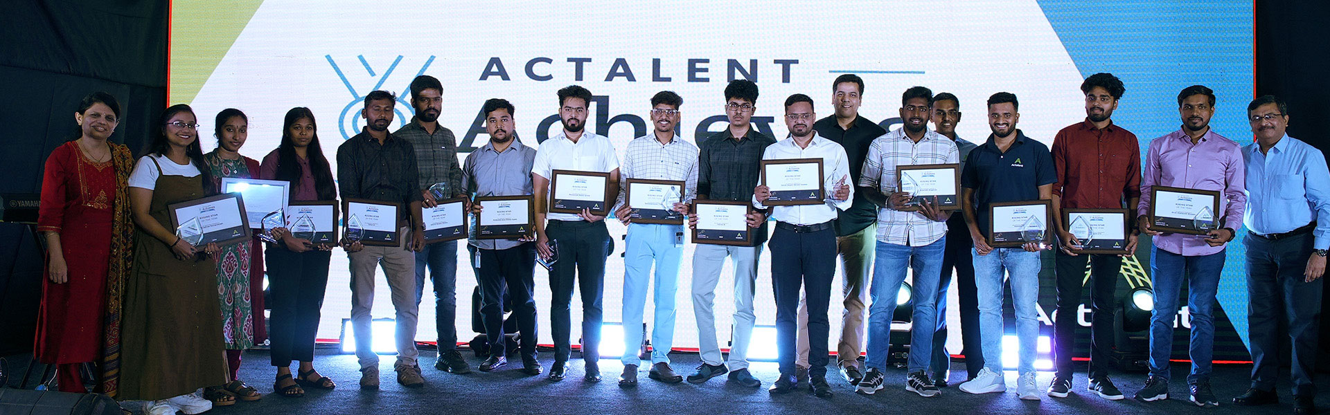 group of achievers holding their awards at the Actalent Gala 2025