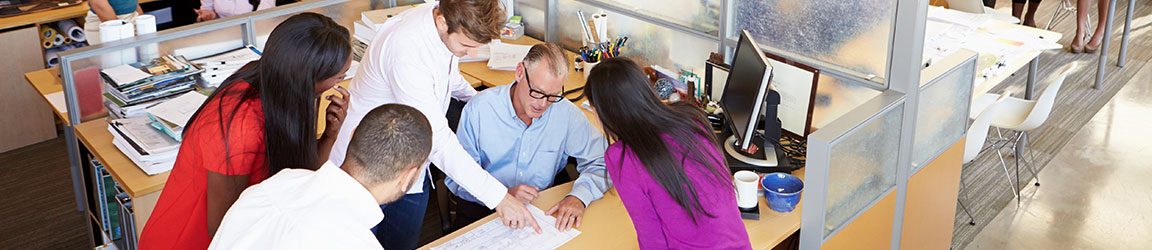 Team of five collaborating at work