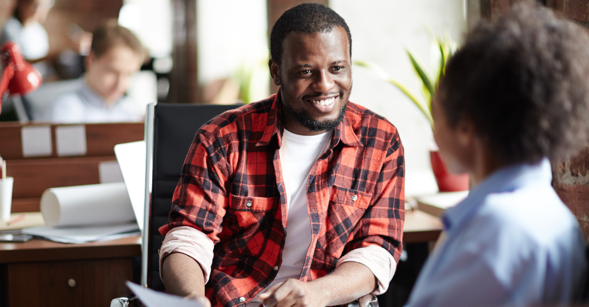 Person smiling during a conversation