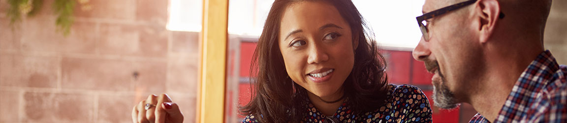 Business casual woman and man having a meeting