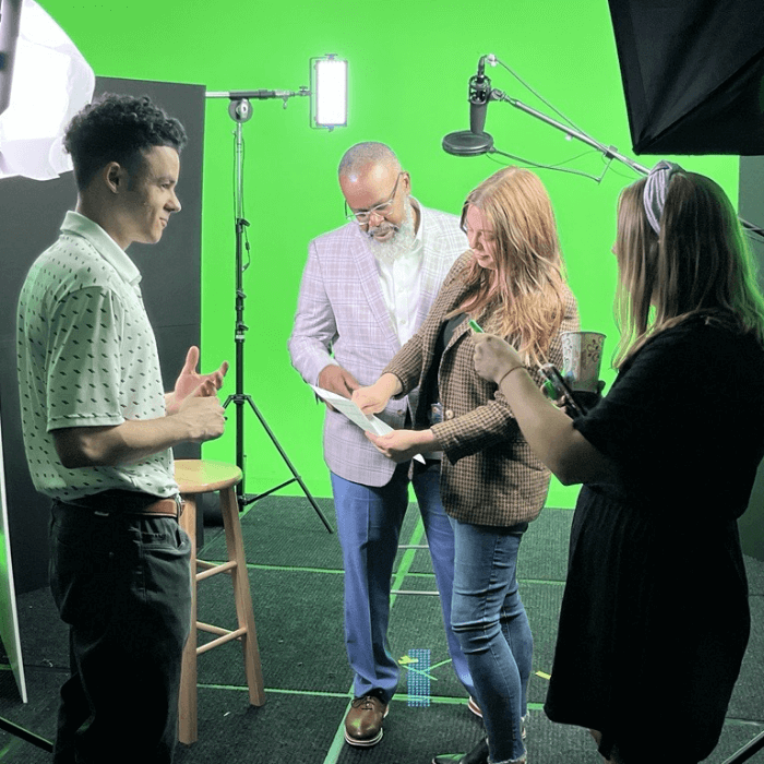 Aston Carter employees film a video