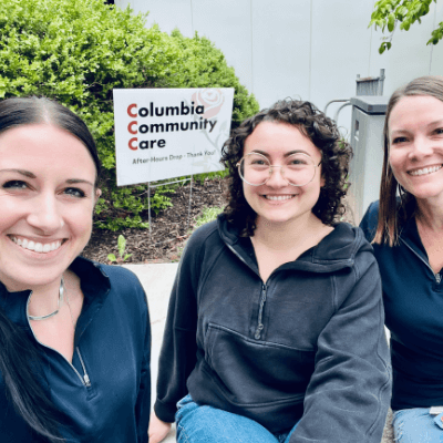 Three Aston Carter women employees volunteering at Columbia Community Care.