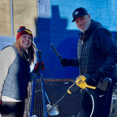 Two Aston Carter employees volunteering.