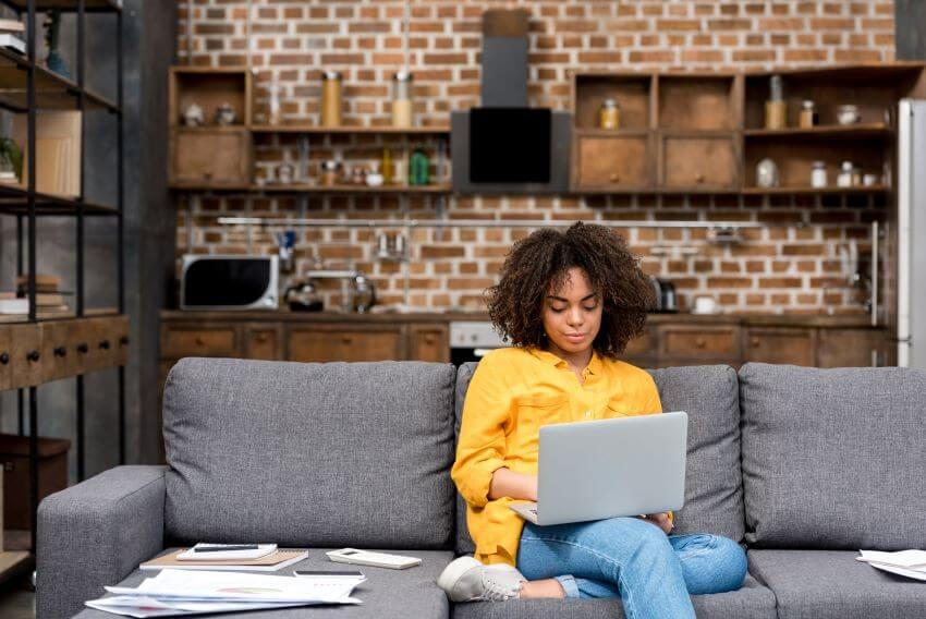 Remote worker on the couch with laptop