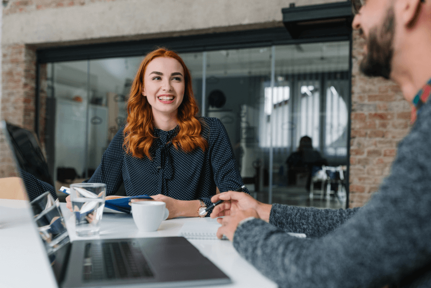 lady interviewing with man in an office