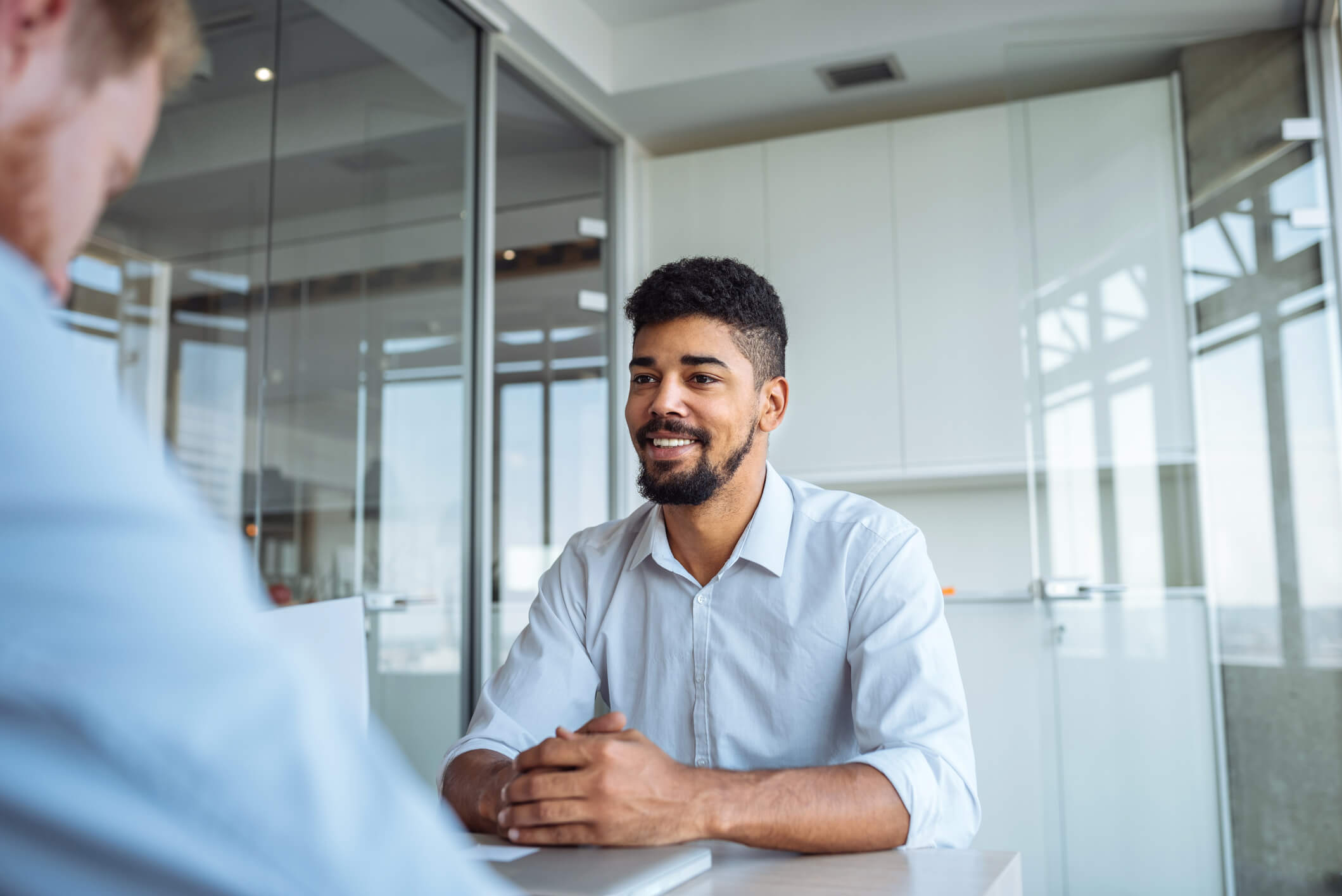 A man using the STAR method to answer behavioral interview questions. 