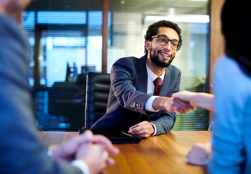 Business people shake hands
