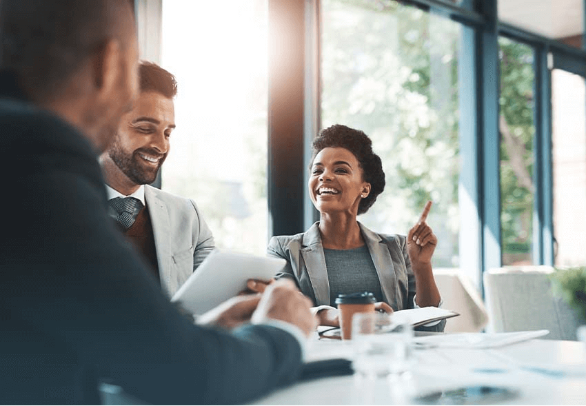 Black woman smiles during a meeting
