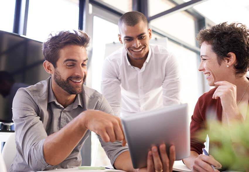 Two men and one woman reviewing the January 2023 labor market report.