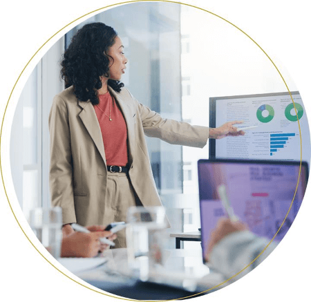 Female finance professional presenting the affects of the tariffs on accounting and finance professionals.