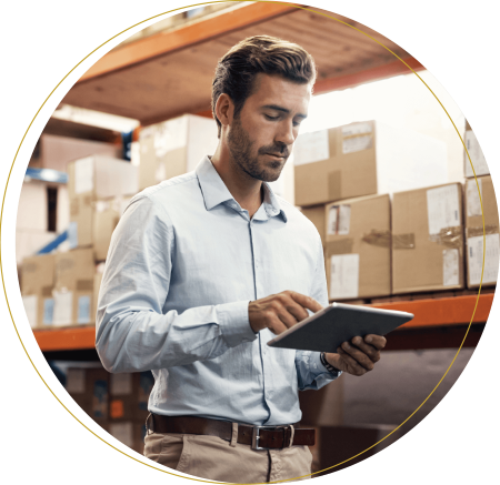 A male professional analyzing how tariffs will impact supply chain and procurement.