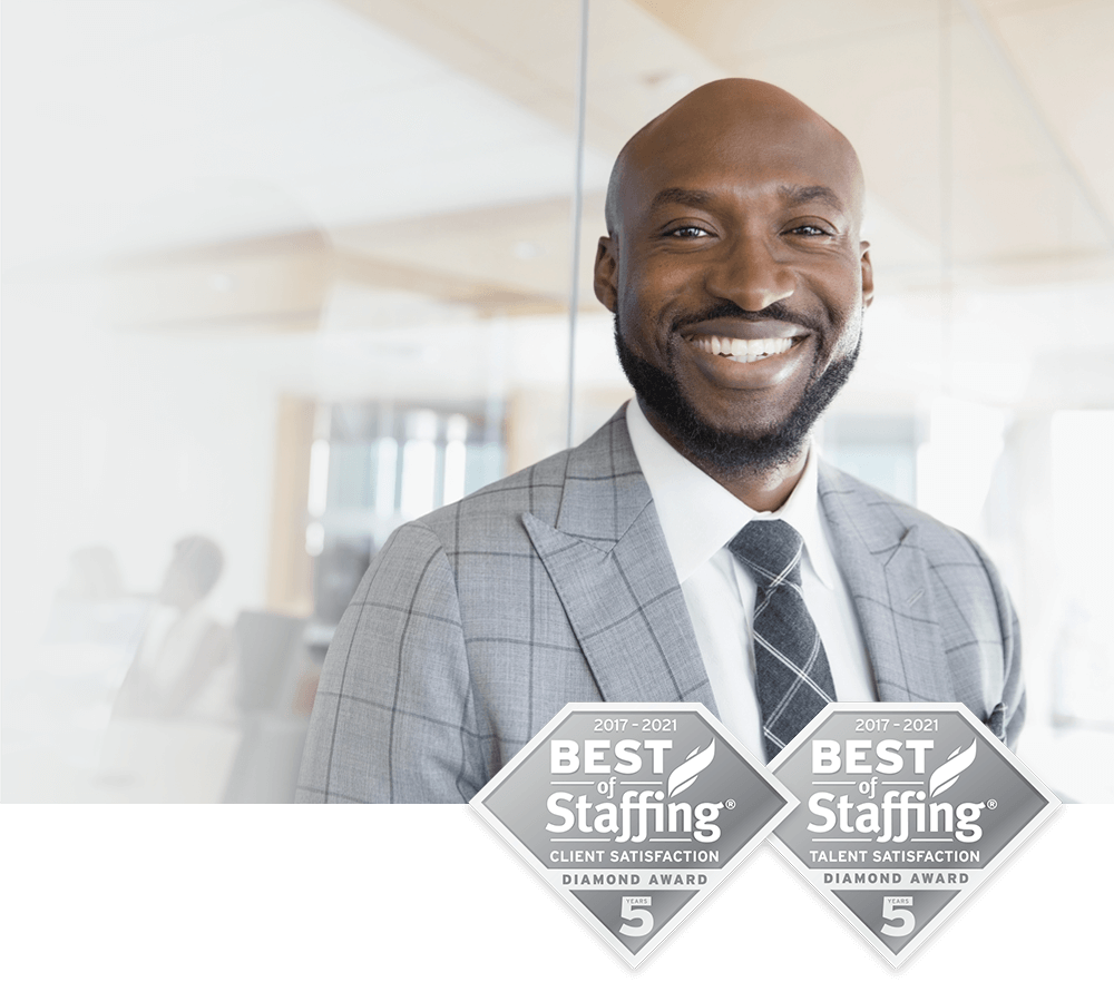 african american man, in a suite, smiling at camera
