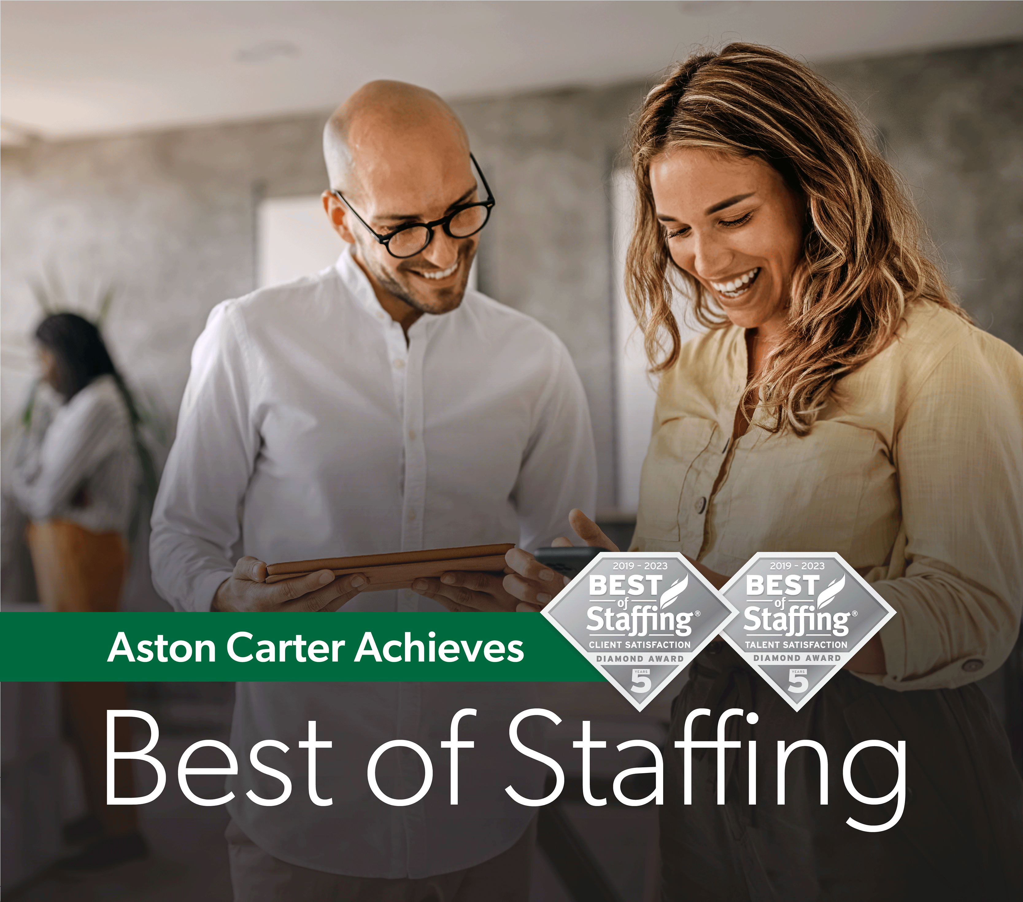A man and a woman having a conversation about Aston Carter achieving the Best of Staffing 2023 award.