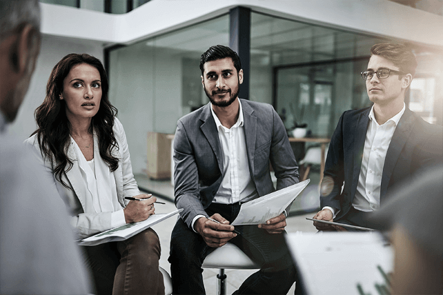 Group of professionals sitting together and having a discussion.